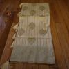Cream Banarasi Silk Saree with Subtle Golden Zari & Tassel Detailing