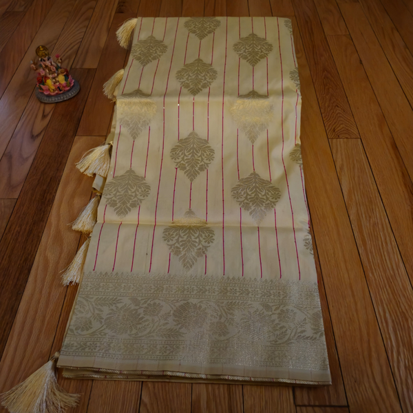 Cream Banarasi Silk Saree with Subtle Golden Zari & Tassel Detailing