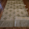 Cream Banarasi Silk Saree with Subtle Golden Zari & Tassel Detailing