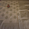 Cream Banarasi Silk Saree with Subtle Golden Zari & Tassel Detailing